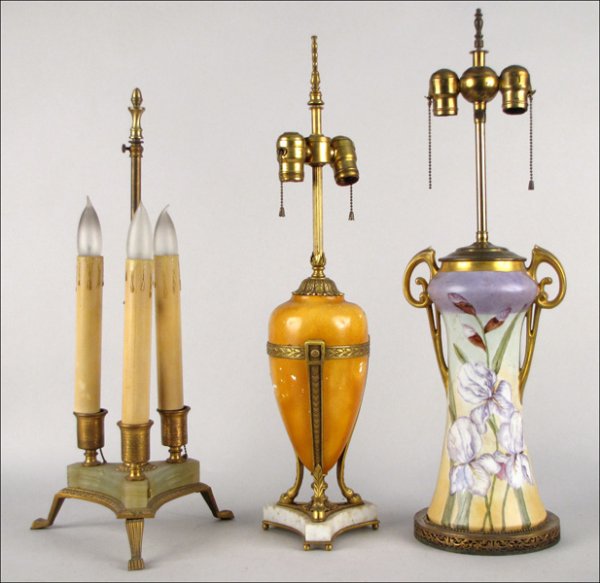 CONTINENTAL PAINTED AND GILT PORCELAIN TABLE LA: CONTINENTAL PAINTED AND GILT PORCELAIN TABLE LAMP. Together with a three-light brass table lamp on a green onyx base, and a Neoclassical style painted metal table lamp Porcelain: 23" Onyx: 22" Metal: