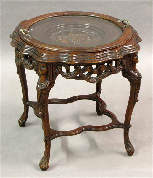 NEOCLASSICAL STYLE CARVED MAHOGANY TRAY TABLE.: NEOCLASSICAL STYLE CARVED MAHOGANY TRAY TABLE. With central relief carved portrait medallion. Glass tray top is removeable 21" x 22.5"