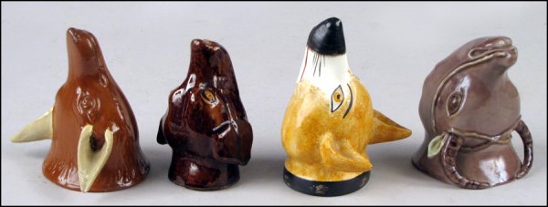 STAFFORDSHIRE POTTERY FOX FORM STIRRUP CUP.: STAFFORDSHIRE POTTERY FOX FORM STIRRUP CUP. Together with a majolica stirrup cup, a stoneware stirrup cup, and a glazed pottery stirrup cup