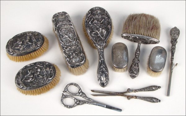 SIX PIECE STERLING SILVER VANITY SET.: SIX PIECE STERLING SILVER VANITY SET. By Foster and Baily, with repousse courting couple motif; Together with four additional stering silver vanity items