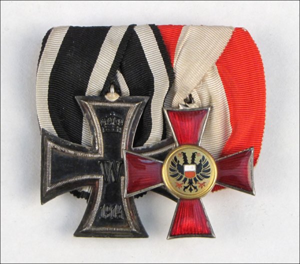 TWO EARLY/MID 20TH CENTURY GERMAN WAR MEDALS.: TWO EARLY/MID 20TH CENTURY GERMAN WAR MEDALS. Including a 1914 Prussian Iron Cross 2nd Class with black and white trim ribbon, obverse bears a crown above a "W" above the year 1914, reverse bears mark