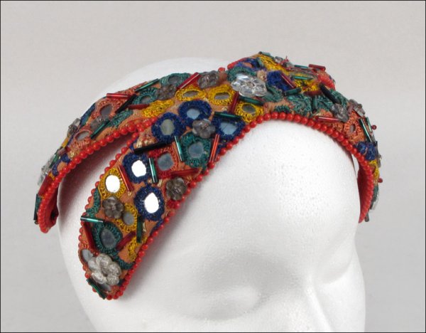 BES-BEN MIRRORED HAT.: BES-BEN MIRRORED HAT. Bandeau is entirely covered in red, blue, and green bugle beads, clear flower form beads, and multi-colored embroidered mirrored pieces