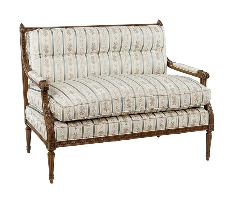 A Louis XVI Style Settee.: A Louis XVI Style Settee. Carved walnut frame with open arms 36" x 48" x 28"