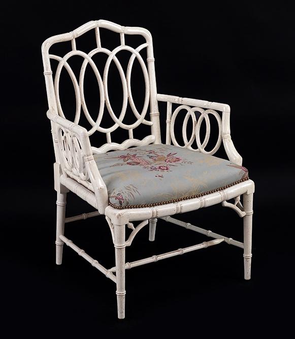 A Whitewashed Armchair.: A Whitewashed Armchair. Bearing a needlepoint upholstered seat Back height: 38"
