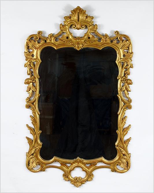 A 19th Century Rococo Style Mirror.: A 19th Century Rococo Style Mirror. Gesso and giltwood mirror with shell form crest at top 52" x 32"