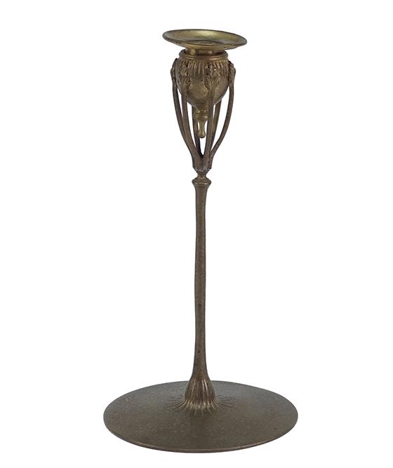 A Tiffany Studios Candlestick.: A Tiffany Studios Candlestick. Dore bronze candlestick is stamped on the underside "Tiffany Studios New York 1210" 9 3/4" x 5"