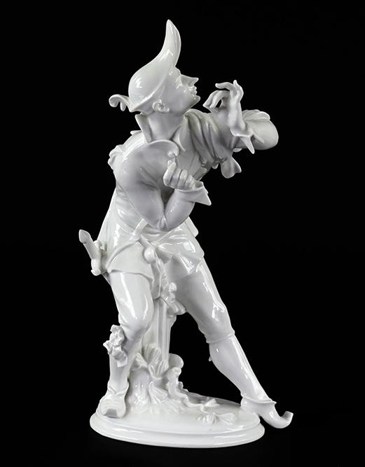 A Meissen Porcelain Figure.: A Meissen Porcelain Figure. Blanc de chine porcelain figure of a man with sword seated atop a tree trunk, signed 'A. Struck' on the base Height: 10 1/2"