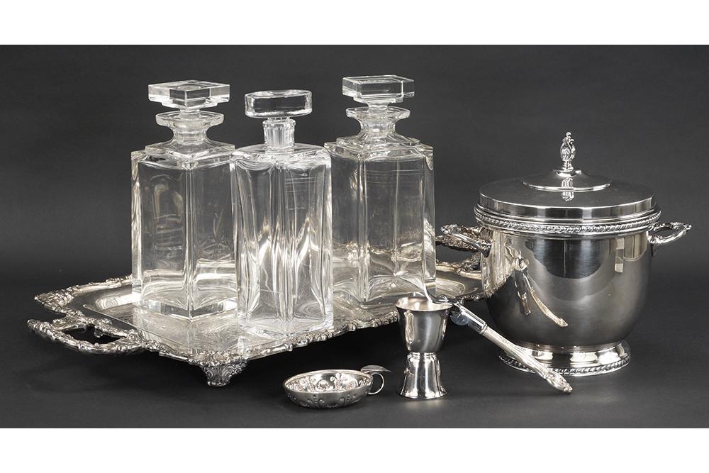 A Collection of Bar Accessories.: A Collection of Bar Accessories. Comprising a pair of crystal decanters, one glass decanter, a covered silverplate ice bucket, a silverplate double jigger shot glass, a silverplate double handled tray