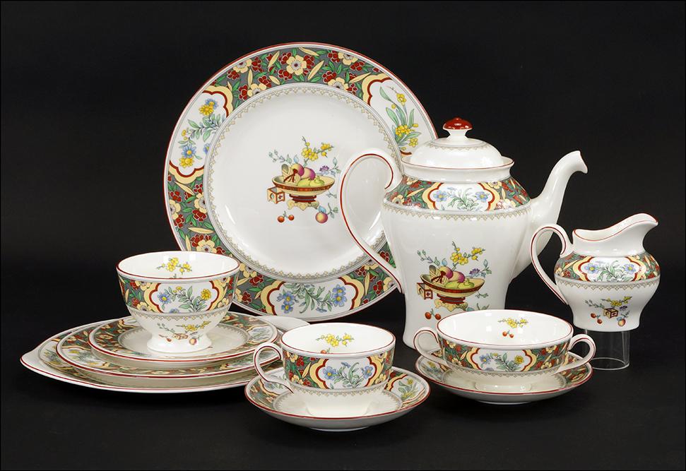 A Minton Porcelain Dinner Service in the Oriental: A Minton Porcelain Dinner Service in the Oriental Blossom Pattern. #S767. Including 8 dinner plates, 8 salad plates, 8 bread plates, 8 boullion cups, 8 coffee cups, 16 saucers, a round serving dish, a