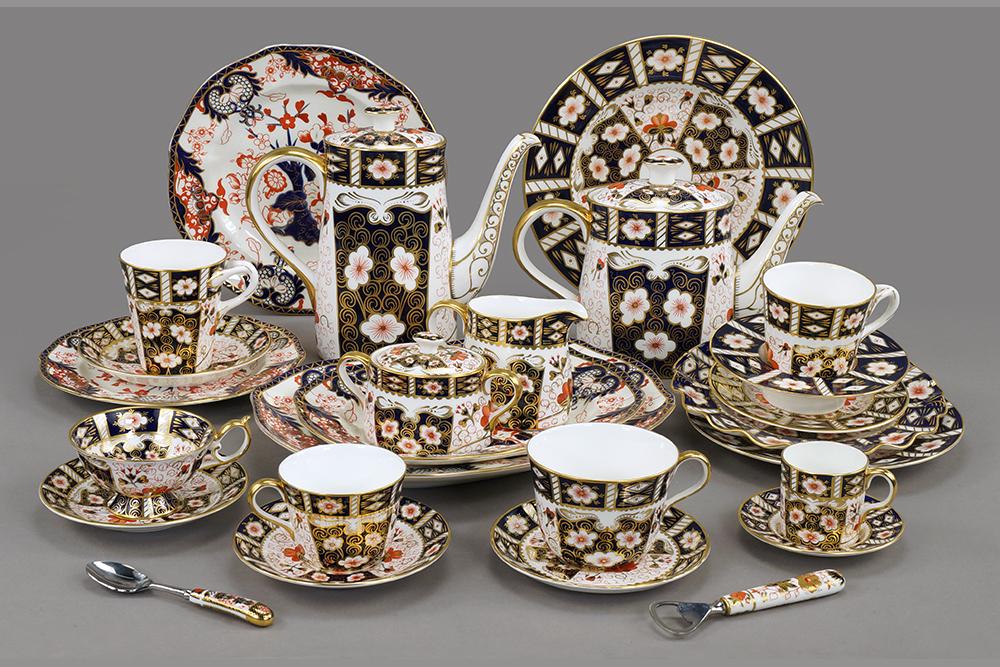 A Royal Crown Derby Partial Dinner Service in the Imari: A Royal Crown Derby Partial Dinner Service in the Imari Pattern. #2451. Including 2 dinner plates, 4 salad plates, 4 ruffle edge dessert plates, 4 bread plates, a coffee pot, a teapot, a creamer and s