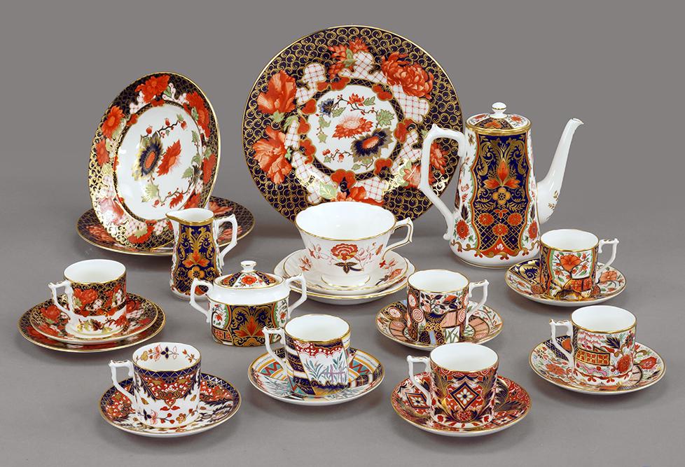 A Royal Crown Derby Partial Dinner Service in the Peony: A Royal Crown Derby Partial Dinner Service in the Peony Pattern. #1283. Including 3 dinner plates, 5 soup bowls, 4 salad plates, 4 bread plates, 4 flat cups and 1 saucer, and 3 coffee cups with saucer