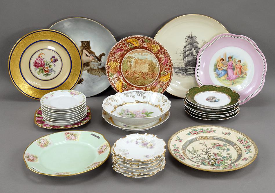 A Collection of Porcelain Table Articles.: Including a Limoges hand painted charger, artist signed and dated, a Lenox charger, a set of nine Rosenthal bread plates, a set of six Austrian salad plates, and others. Limoges charger: 12 1/4"
