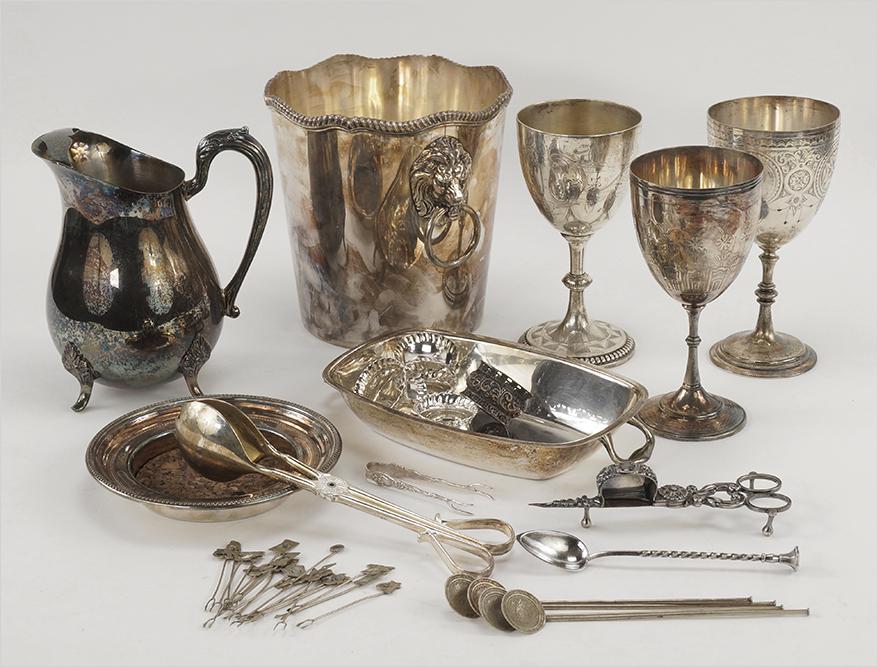 A Collection of Silverplate.: A Collection of Silverplate. Including an ice bucket, three goblets with goldwash interiors, a pitcher, a wine coaster, a set of four napkin rings, another napkin ring, a wick trimmer, a cocktail spoo