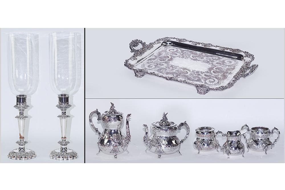 An English Silverplate Tea and Coffee Service.: An English Silverplate Tea and Coffee Service. Comprising a coffee pot, teapot, creamer, sugar, and waste pot. Together with a silverplate handled tray (3" x 29" x 19") and a pair of weighted silverpl