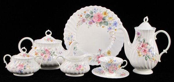 ROYAL DOULTON PORCELAIN DINNER SERVICE IN THE A: ROYAL DOULTON PORCELAIN DINNER SERVICE IN THE ARCADIA PATTERN. Comprised of twelve dinner plates, thirteen salad plates, twelve bread plates, twelve fruit bowls, eleven cereal bowls, twelve soup bowls