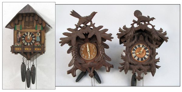 TWO CARVED PINE BLACK FOREST CUCKOO CLOCKS.