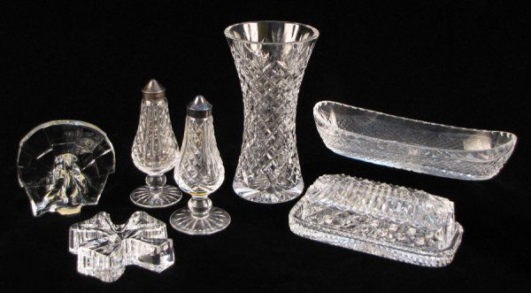 COLLECTION OF WATERFORD CRYSTAL TABLE ARTICLES.: COLLECTION OF WATERFORD CRYSTAL TABLE ARTICLES. Comprised of one pair of salt and pepper shakers with their original box, one covered butter dish, one vase, one condiment server, and one shamrock with