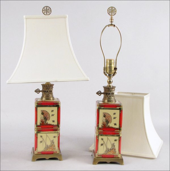 PAIR OF CHINESE TABLE LAMPS.: PAIR OF CHINESE TABLE LAMPS. Each comprised of two stacked decorated tin tea cannisters as the lamp base Height: 22.5"