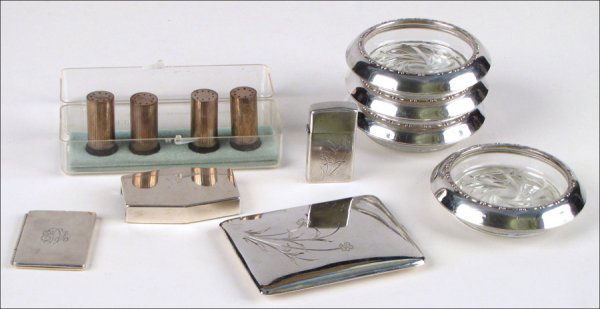 COLLECTION OF STERLING SILVER TABLE ARTICLES.: COLLECTION OF STERLING SILVER TABLE ARTICLES. Comprised of four salt and pepper shakers, four coasters, a Tiffany & Co. monogrammed travel picture frame, a Tiffany & Co. monogrammed bottle opener, and