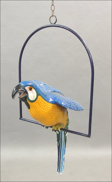 SERGIO BUSTAMANTE (MEXICAN, B. 1942) MACAW ON P: SERGIO BUSTAMANTE (MEXICAN, B. 1942) MACAW ON PERCH. Painted papier mache, edition 68/100, signed under left wing H: 43" W: 23" D: 16"