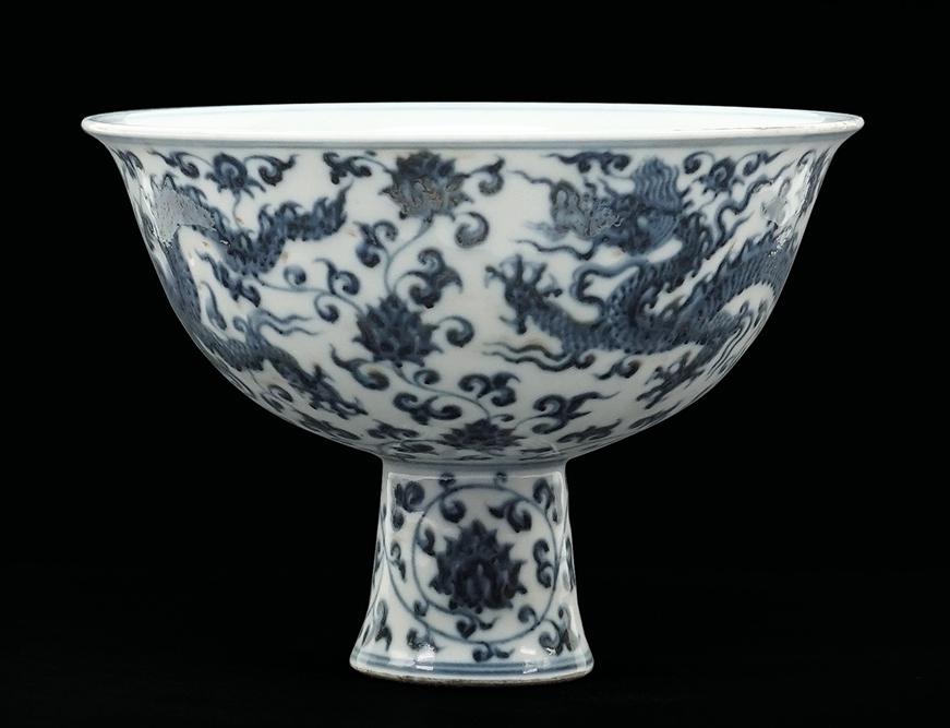 A Chinese Blue and White Porcelain 'Dragon' Stem Cup.: A Chinese Blue and White Porcelain 'Dragon' Stem Cup. Bearing an underglaze inscription to the interior and an underglaze blue four-character Ming mark on the underside 4 3/4" x 6 1/2"