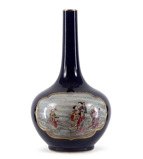 A Chinese Famille Rose Porcelain Bottle Vase.: A Chinese Famille Rose Porcelain Bottle Vase. Cobalt ground with famille rose medallions depicting figures, bearing an underglaze blue archaic Qianlong mark on the underside Height: 16"