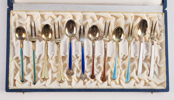 SIX SETS OF STERLING SILVER AND ENAMEL DEMITASS: SIX SETS OF STERLING SILVER AND ENAMEL DEMITASSE SPOONS AND FORKS. Green, yellow, and red sets are by David Andersen. Cobalt blue and white sets are by TH Marthinsen. Turquoise set is marked "T Norway