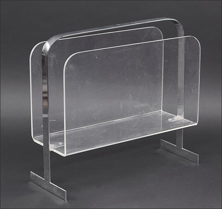 A Milo Baughman Chrome and Lucite Magazine Rack.: A Milo Baughman Chrome and Lucite Magazine Rack. 15" x 16" x 6"