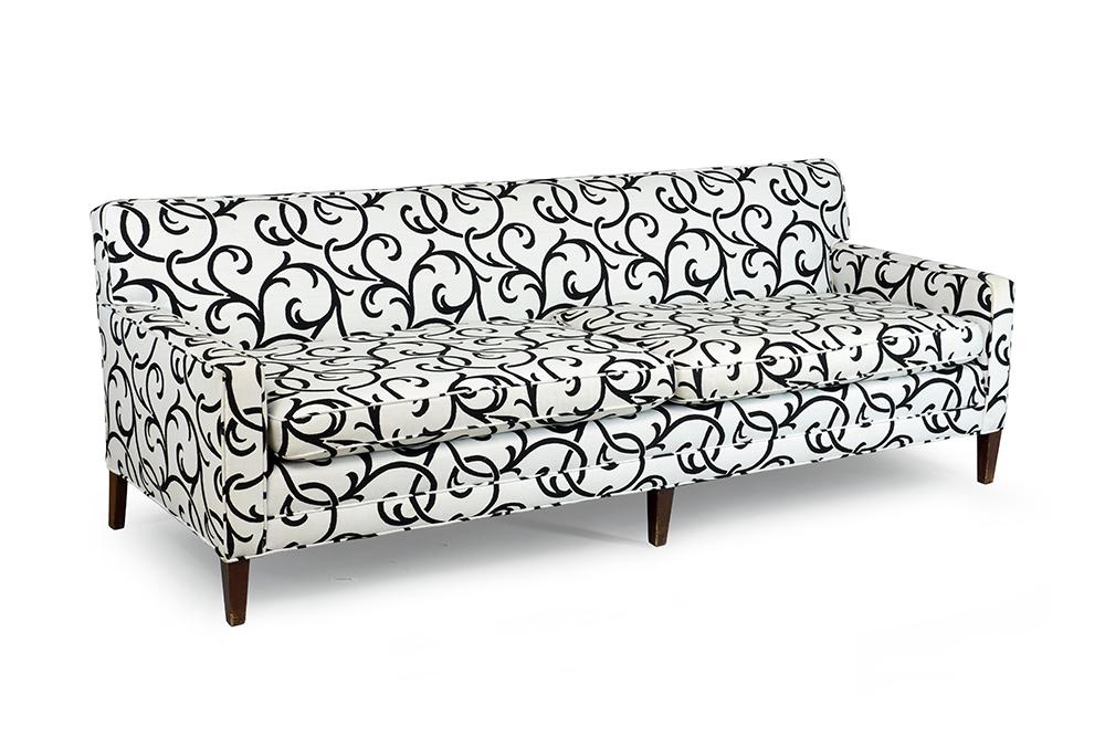 A Contemporary Sofa.: A Contemporary Sofa. Black and white upholstered two-cushion sofa raised on wood legs 29 1/2" x 86" x 30"