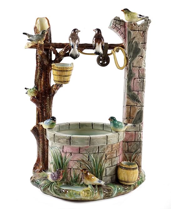 Jerome Massier (French, 1850-1916) The Wishing Well.: Jerome Massier (French, 1850-1916) The Wishing Well. Majolica wishing well with nine birds perched throughout the ground, tree branch and right support. Underside is signed "Jerome Massier Fils / Vall