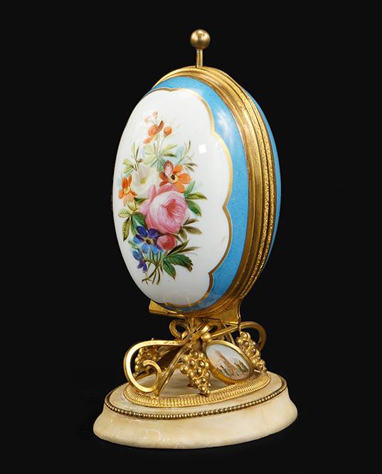 Sevres French Porcelain Gold Gild Egg Sewing Box/Kit.: Sevres French Porcelain Gold Gild Egg Sewing Box/Kit. Featuring an egg shaped push button opening sewing kit, containing scissors, needle case, thimble, large bore needle and a hole punch. In a gold g