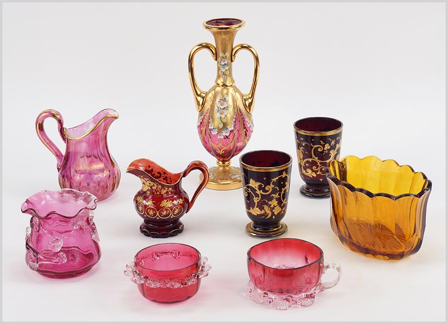 A Pair of Gilt Ruby Glass Beakers.: A Pair of Gilt Ruby Glass Beakers. Together with a faceted amber glass bowl, a cut cranberry glass pitcher, a gilt ruby glass creamer, a gilt and painted cranberry glass double handled vase, a cranber