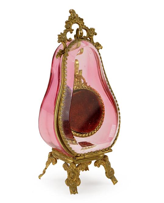 VICTORIANN CRANBERRY GLASS POCKET WATCH HOLDER.: VICTORIANN CRANBERRY GLASS POCKET WATCH HOLDER. Featuring a Victorian cranberry sided and beveled glass pocket watch display holder Height: 6 1/4"