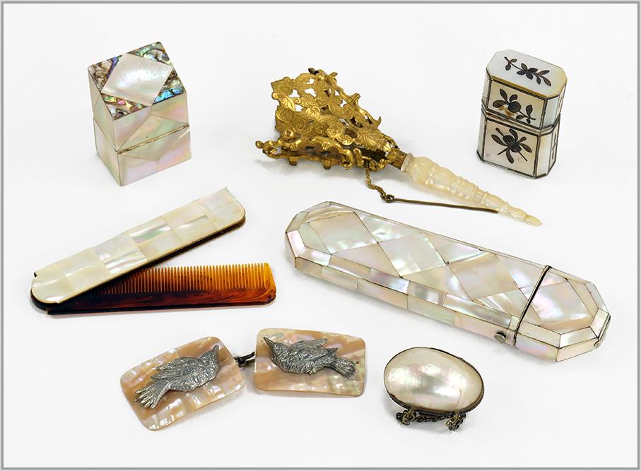 Victorian Mother of Pearl Dresser Items.: Victorian Mother of Pearl Dresser Items. Consisting of a glass case, folding comb, perfume bottle, needle case, small purse, dress buckle and posy holder Posy Holder: 5 1/4" x 2"