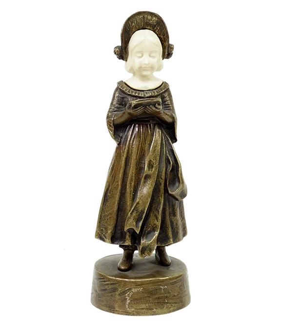 Peter Tereszczuk (Austrian, 1874-1963), Figural Bronze.: Peter Tereszczuk (Austrian, 1874-1963), Figural Bronze. Peter Tereszczuk (Austrian, 1874-1963), figural bronze with carved head, depicting standing young female standing with a book, signed and marked