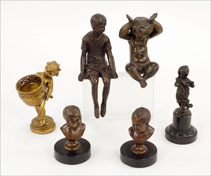 A Group of Small Patinated Metal and Bronze Figurines.: A Group of Small Patinated Metal and Bronze Figurines. Consisting of two bronze bust of a child on a marble base, a gold gilt metal child with a basket, a reclining child, a small child on a pedestal 
