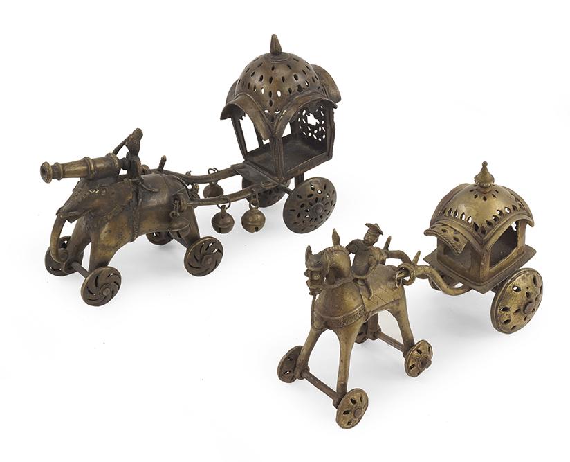 Two Indian Brass Temple Toys.: Two Indian Brass Temple Toys. Comprising a carriage being pulled by an elephant with rider and mounted cannon and a carriage being pulled by a horse with armed rider Elephant carriage: 8" x 12 1/2" x 