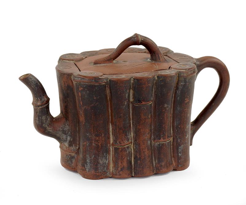 A Chinese Zisha Teapot.: A Chinese Zisha Teapot. Bamboo decorated exterior with a tapering form 4 1/2" x 7 1/4" x 3 7/8"