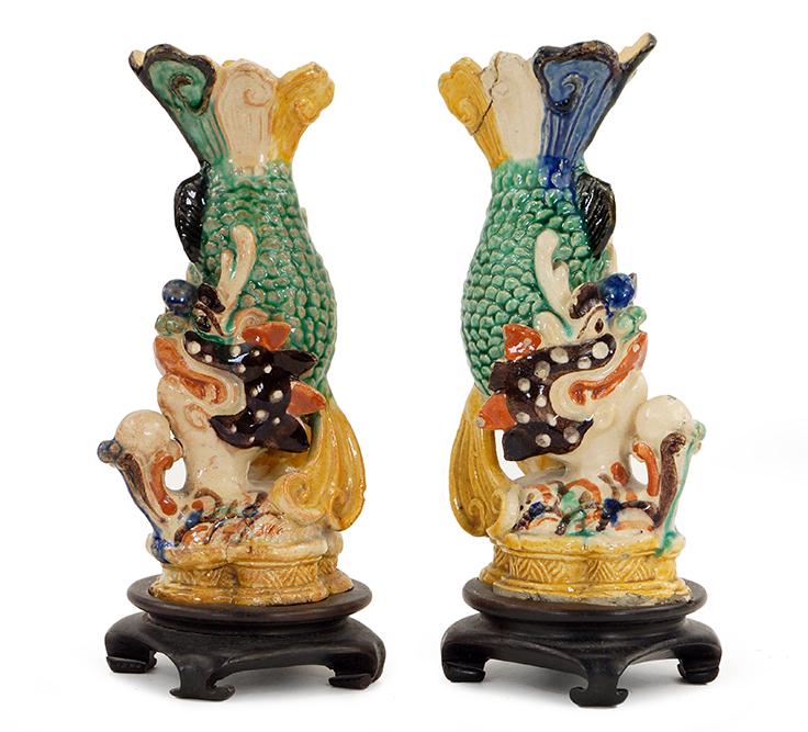 A Pair of Chinese Roof Tiles.: A Pair of Chinese Roof Tiles. Polychrome glazed ceramic roof tiles in the form of inverted fish. Raised on 1 1/4" wood stands Tile height: 7 7/8"