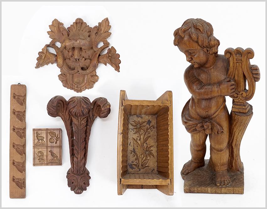A Group of Carved Wood Items.: A Group of Carved Wood Items. Consisting of a standing carved child with a harp, carved wood molds, carved wood plume and a carved wood face Child: 21" x 8" x 8"