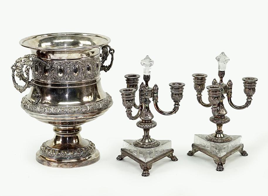 A Pair of Three-Light Candelabra.: A Pair of Three-Light Candelabra. Silverplate three-light candelabra raise don triangular etched glass bases. In the style of Pairpoint. Together with a silverplate double handled wine cooler / champa