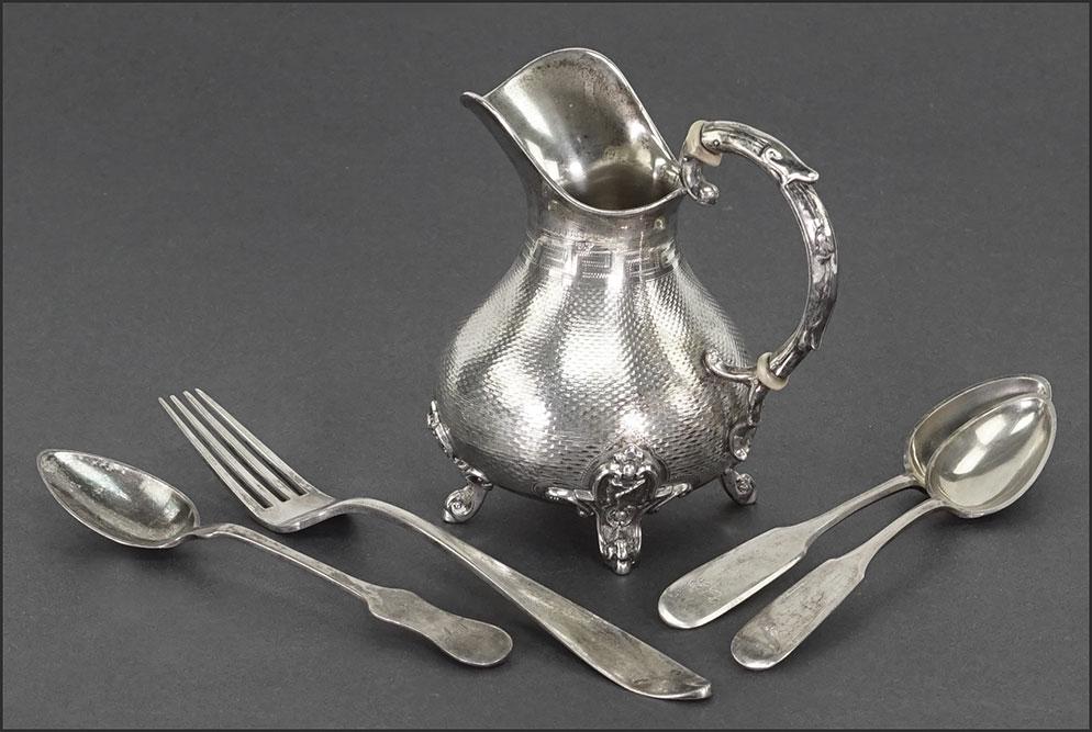 A Collection of Austrian Silver.: A Collection of Austrian Silver. Comprising a creamer height: 4 3/4"), a pair of spoons (6 1/2"), a fork (8 1/4") and a teaspoon Wt of all: 9/75 ozt
