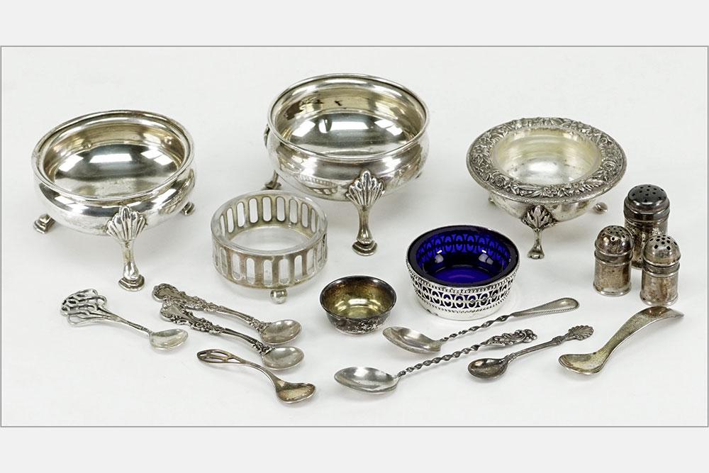 A Collection of Sterling Silver Salt Cellars.: A Collection of Sterling Silver Salt Cellars. Comprising one pair of open cellars, two with clear glass liners, one with a cobalt glass liner and one without a liner. Together with one pair of sterlin