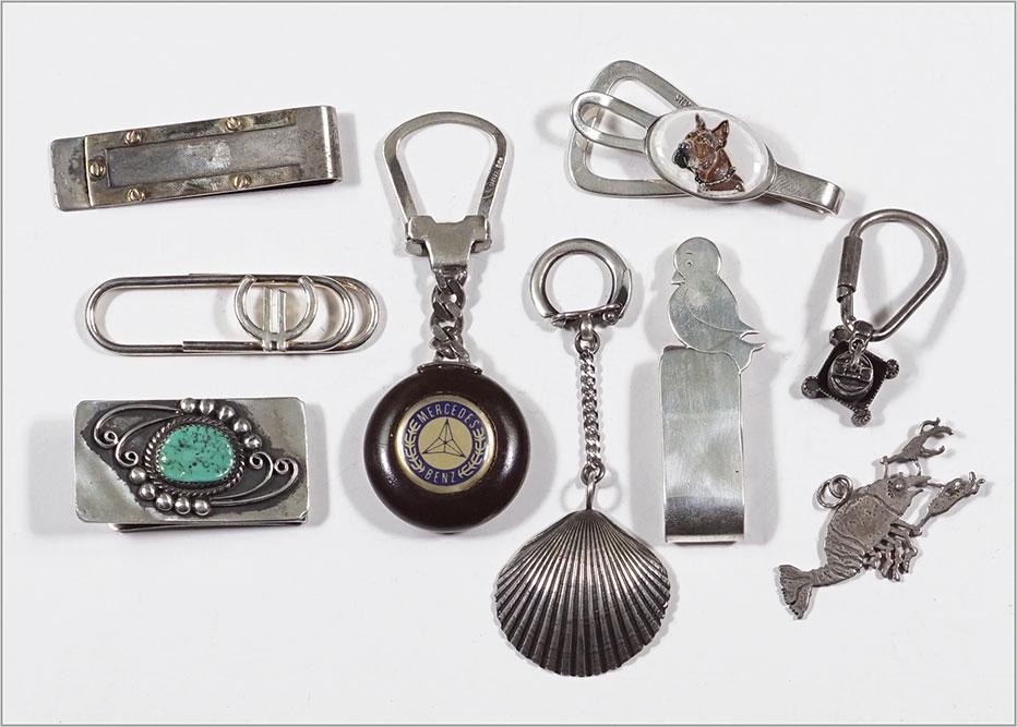 Four Sterling Silver Money Clips.: Four Sterling Silver Money Clips. Together with a sterling silver scorpion pendant, an unmarked silver and turquoise money clip, a sterling silver shell form keyring, an .800 silver temple keyring and