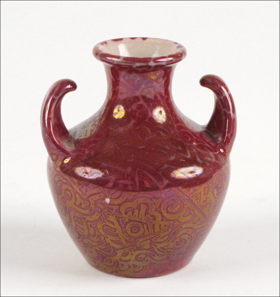 CLEMENT MASSIER HAND PAINTED AND GLAZED IRRIDESCENT CER: CLEMENT MASSIER HAND PAINTED AND GLAZED IRRIDESCENT CERAMIC DOUBLE HANDLED BUD VASE. Marked CM 1889 GJ Height: 3.75"