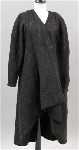 FENDI BLACK BROCADE WOOL BLEND SWING COAT.: FENDI BLACK BROCADE WOOL BLEND SWING COAT. Tapered front of coat can also be worn as a Kabuki style coat Size 42