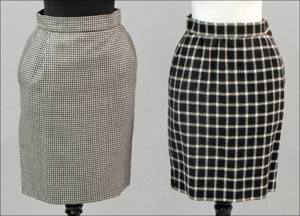 EMANUEL UNGARO BLACK AND WHITE HOUNDSTOOTH WOOL SKIRT.: EMANUEL UNGARO BLACK AND WHITE HOUNDSTOOTH WOOL SKIRT. Together with an Emanuel Ungaro black and white window plaid wool skirt Both size 6