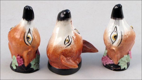 PAIR OF STAFFORDSHIRE STIRRUP CUPS.: PAIR OF STAFFORDSHIRE STIRRUP CUPS. Together with one Staffordshire stirrup cup