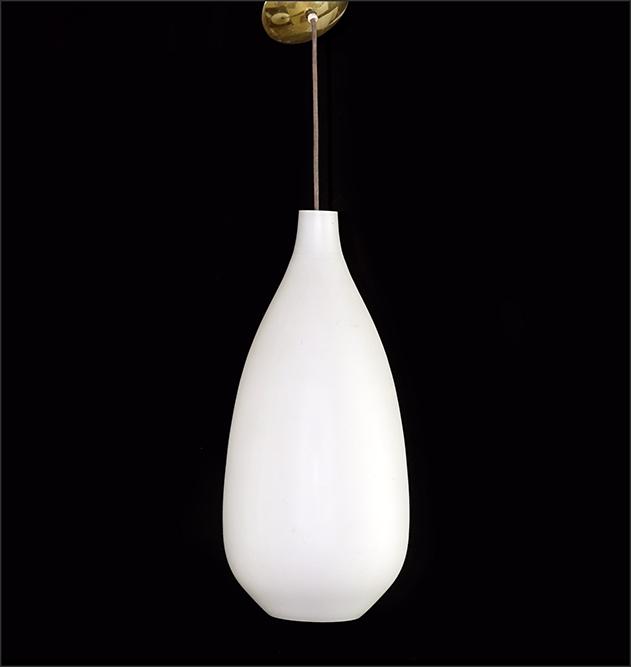 A Lightolier Mid-Century Teardrop Chandelier.: A Lightolier Mid-Century Teardrop Chandelier. Circa 1955, single light fixture with a frosted milk glass shade and brass ceiling cap Shade: 27" x 11"