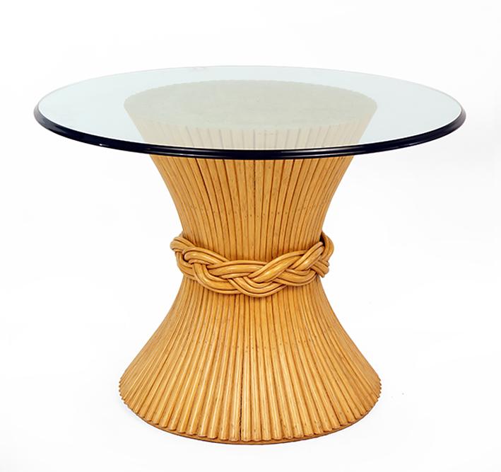 A McGuire 'Sheaf of Wheat' Table.: A McGuire 'Sheaf of Wheat' Table. Tapering wood base with a braided knot around the middle. With a round glass top 29" x 40"